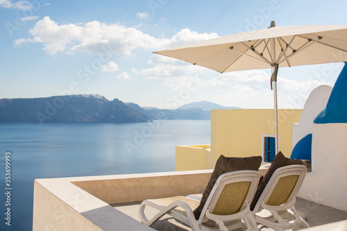 View from a balcony in Oia village  Santorini island  Greece. Balcony overlooks caldera and the volcano. 