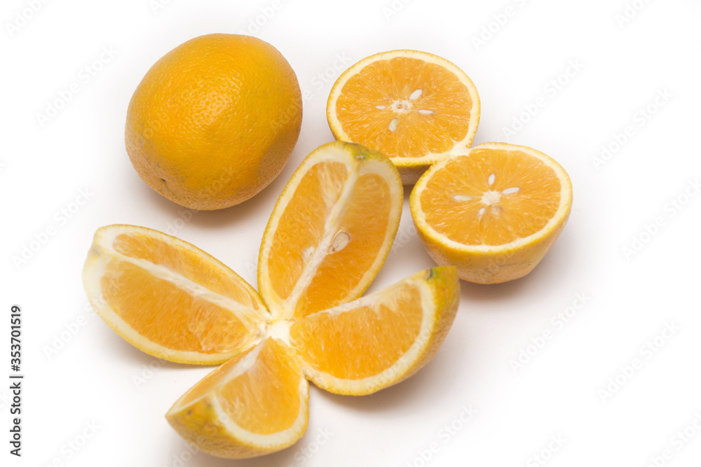 Orange fruit with orange slices and leaves isolated on white background. Orange fruit with orange slices and leaves isolated on white background.