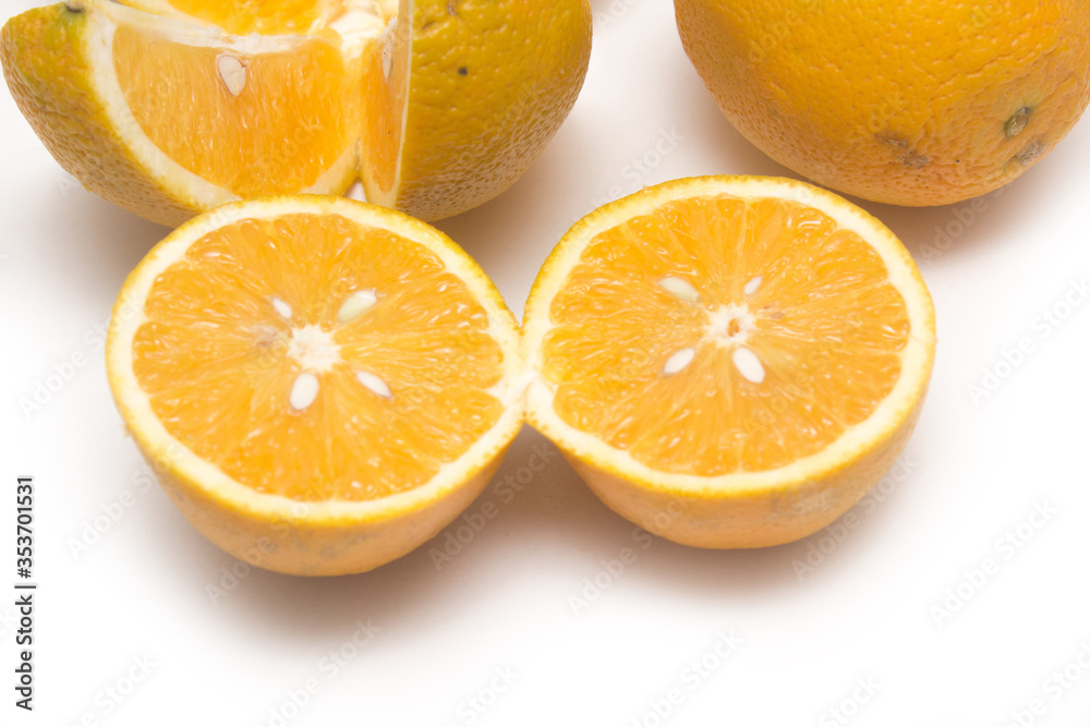 Orange fruit with orange slices and leaves isolated on white background. Orange fruit with orange slices and leaves isolated on white background.