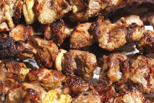 Grilled kebab. Roasted meat with onions. Background from food. Pork