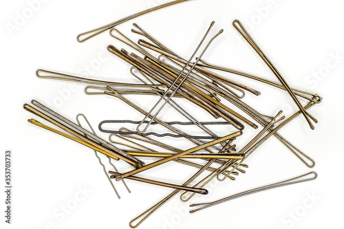 metal hairpins on white background