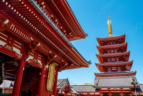 Tokyo, Japan - 08 May, 2019: People at Sensoji buddhism temple, popular temple in Tokyo. The temple is approached via the Nakamise, with shopping street, providing tourist. photo