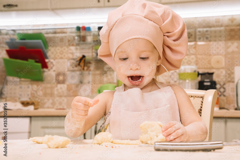 Little girl cooks at home in the kitchen Little girl cooks at home in the kitchen