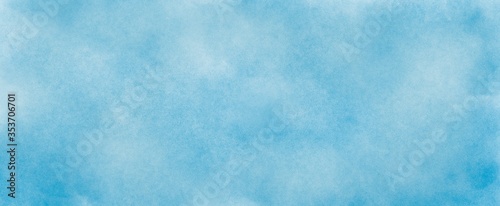 Light blue watercolor background hand-drawn with copy space for text 