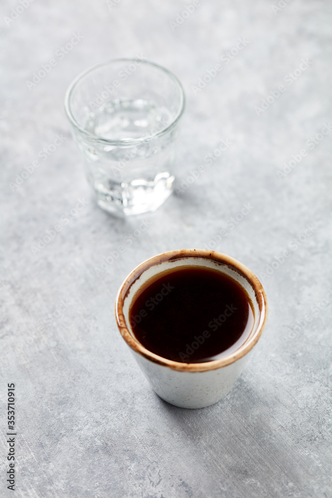 Cup of coffee on bright stone background. Copy space
Cup of coffee on bright stone background. Copy space