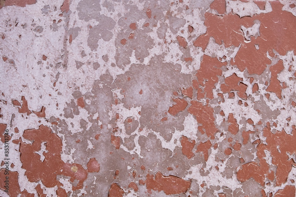 old shabby gray white concrete wall with peeling red paint. rough surface texture old shabby gray white concrete wall with peeling red paint. rough surface texture