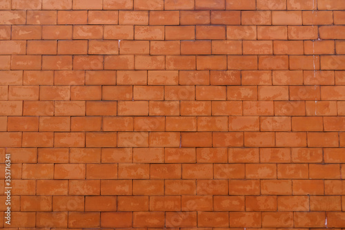 Orange brick patterned brick wall background, wall texture and backdrop for architectural materials