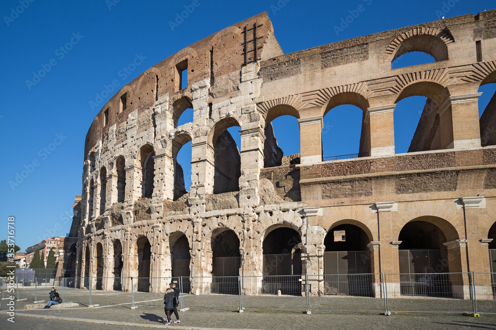 Tourists visit Colosseum ruins in Rome. It is the greatest roman building in the world.