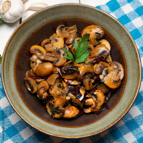 Mexican mushrooms with garlic and guajillo chili peppers also called "al ajillo" on white background