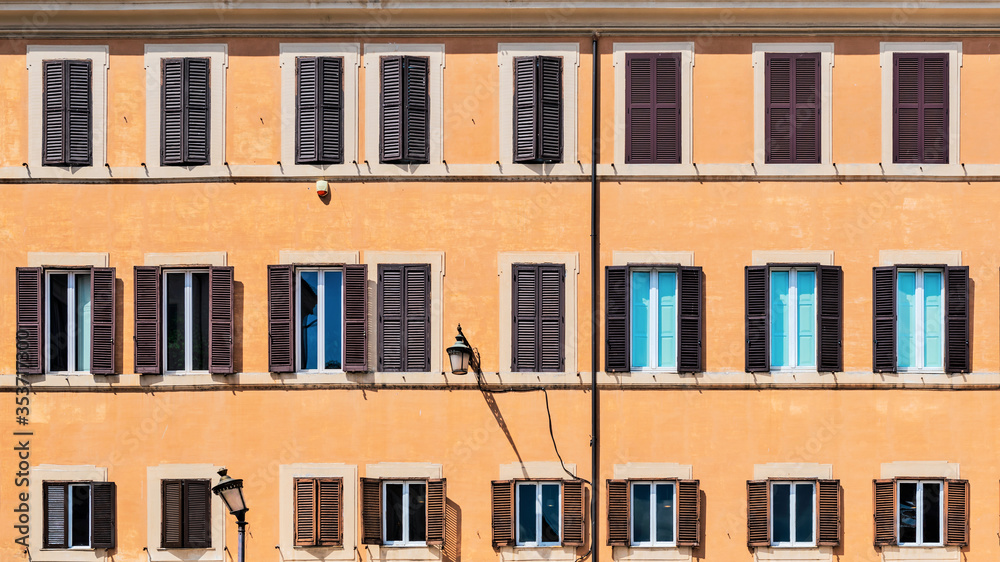 Buiding wall with windows  in Campo de' Fiori in Rome, Italy.