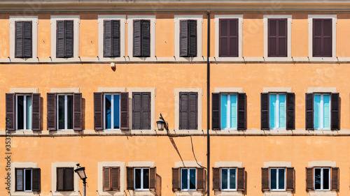 Buiding wall with windows in Campo de' Fiori in Rome, Italy.