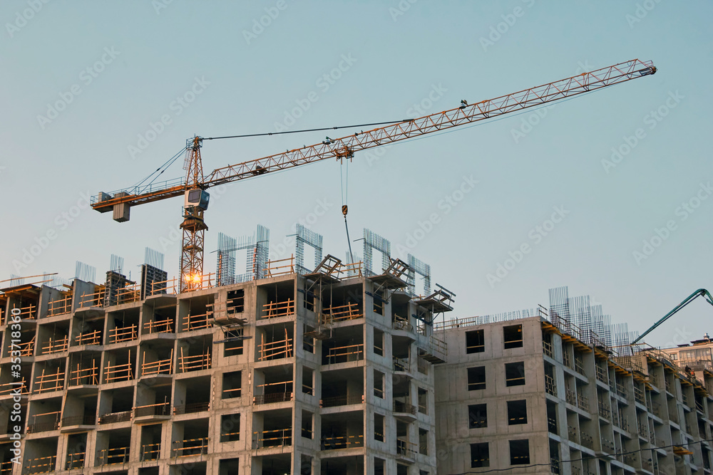 Industrial construction cranes the construction of an building Industrial construction cranes the construction of an building