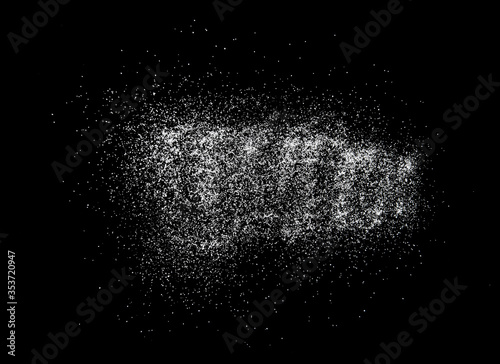 Small crystals of sea salt on black background, top view
