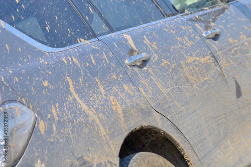 Close up of a dirty car in the city