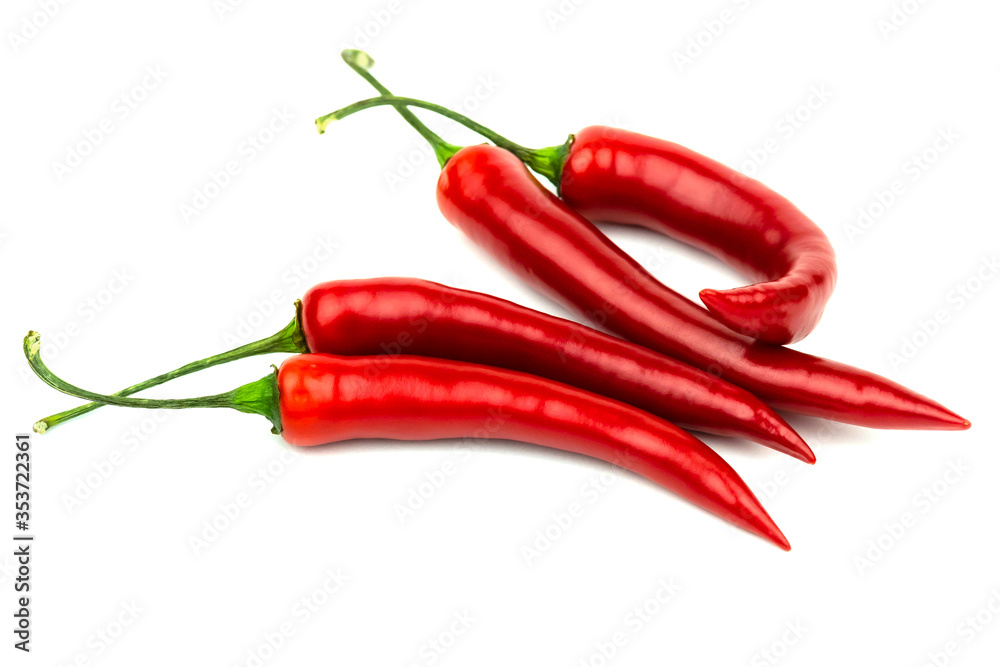 Several red hot peppers on a white background