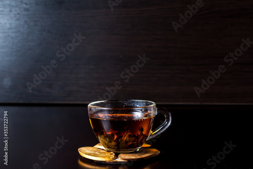 tea with lemon in a transparent glass cup