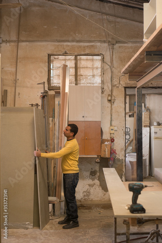 man working in carpenter workshop 