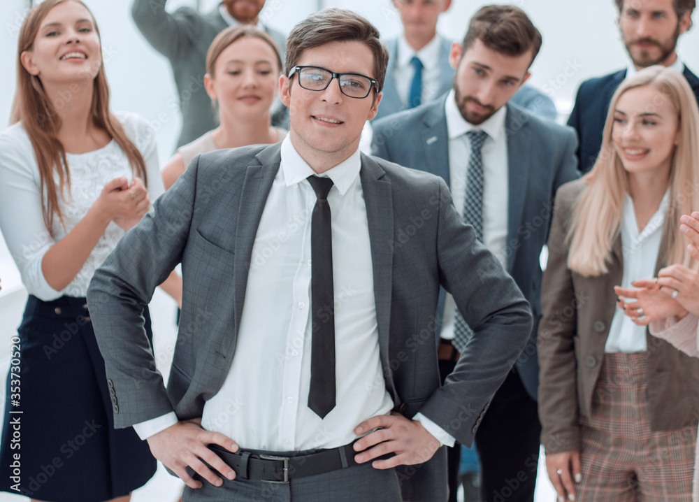 boss and the gleeful business team standing together boss and the gleeful business team standing together