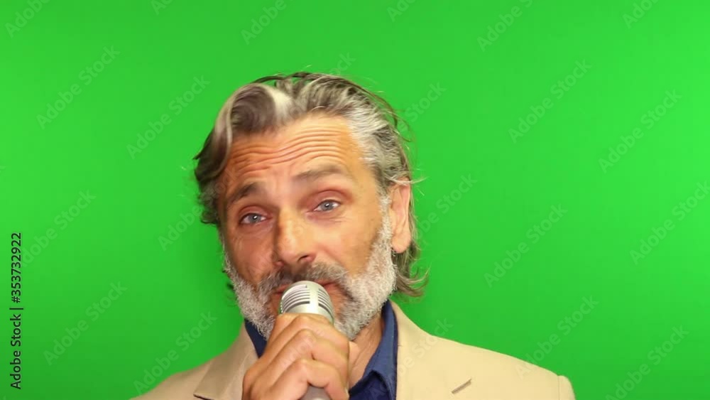 Mature man giving a speech over green screen Mature man giving a speech over green screen