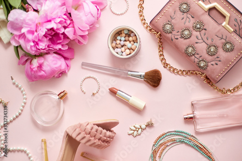 Beauty and fashion accessories and gadgets. Femine concept. Flat lay on pink theme background