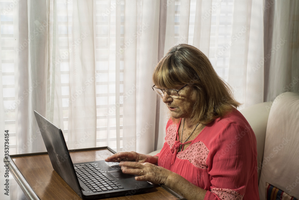 older woman using modern technologies on her devices to communicate while meeting social distancing older woman using modern technologies on her devices to communicate while meeting social distancing