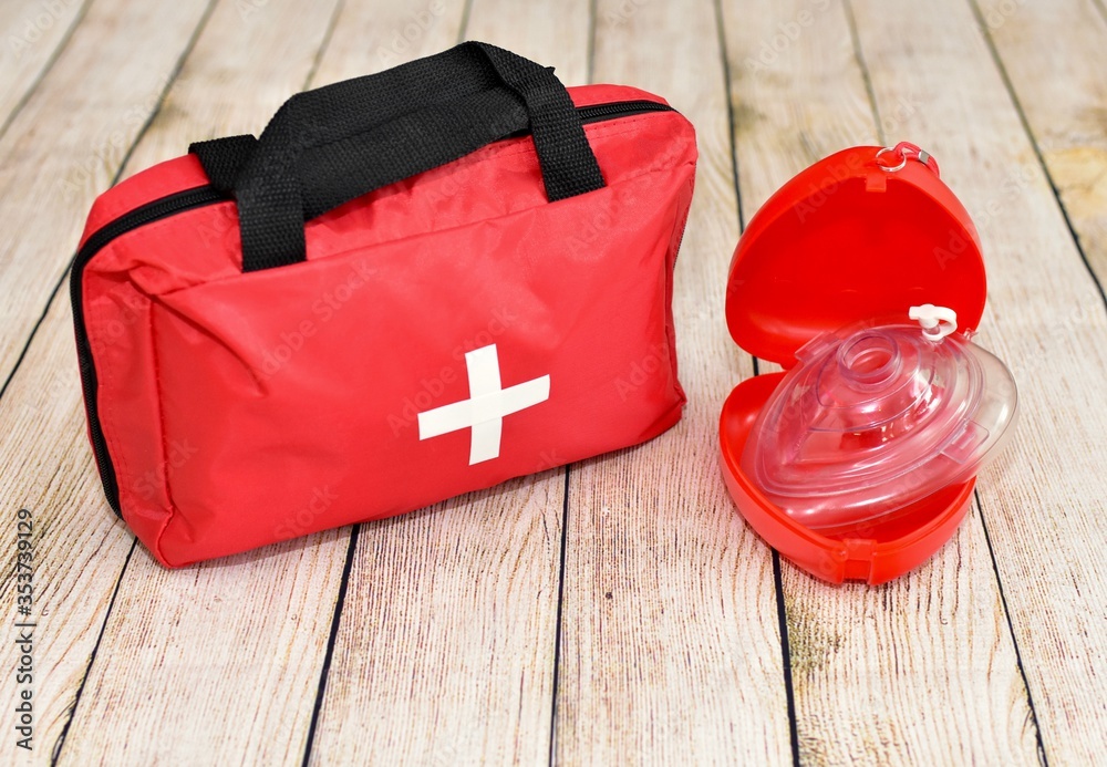 Naklejka premium First aid supplies and emergency kit for disaster relief and helping during trauma incidents and first responders