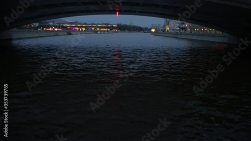 Shooting from a ship under the bridge, away from the center of the metropolis