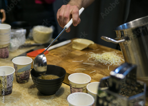 French onion soup is being prepared for serving