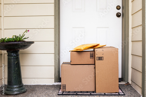 Front Entryway of House with Stack of Delivery Boxes from Online Ordering and E-commerce