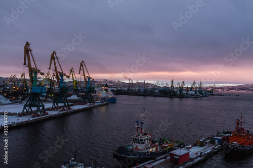 General view of the cargo port. Cargo cranes await the arrival of the vessel for loading unloading coal in the seaport.