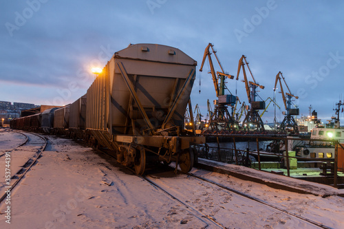 General view of the cargo port. Freight railroad cars await unloading near the coal terminal. Freight gantry cranes unload railroad freight cars
