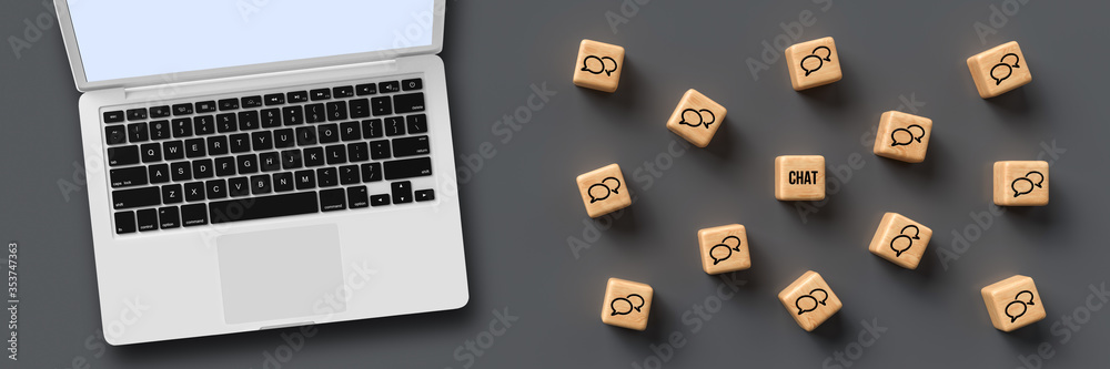 cubes with speech bubble icons and a computer on grey background