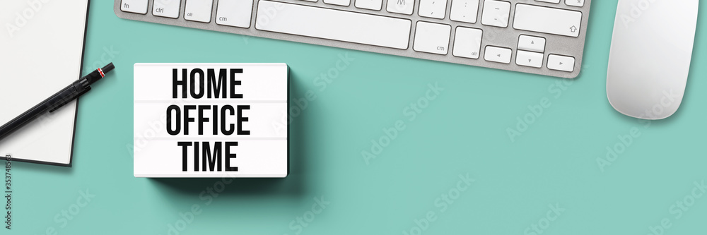 lightbox with message HOME OFFICE TIME surrounded by office items on grey background lightbox with message HOME OFFICE TIME surrounded by office items on grey background