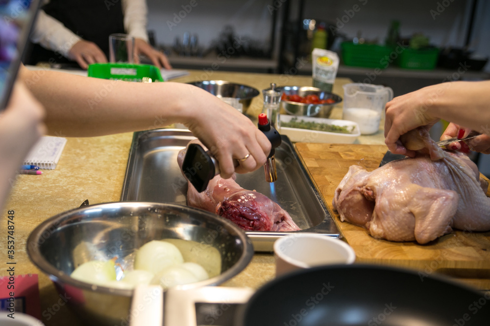 preparing meat in a professional kitchen