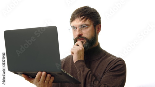 Elegant and confident business manager wearing eye glasses and holding laptop hands isolated on white background.