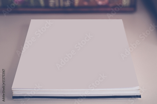 Business composition of photo albums with a notebook on the table