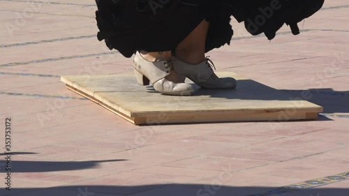 4K. Ultra HD. Woman practices flamenco dancing on a stage. Flamenco dancer in Seville, Spain.