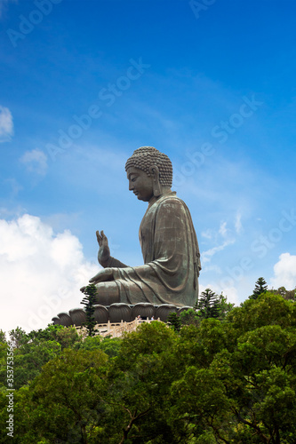 The historical Tian Tan Buddha large statue in the Ngong Ping village of Lantau Island.