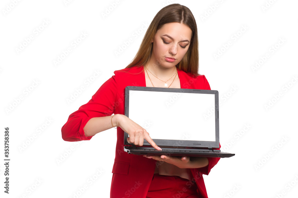 office woman looking at camera smiling, Holding a laptop, shows a finger at him office woman looking at camera smiling, Holding a laptop, shows a finger at him