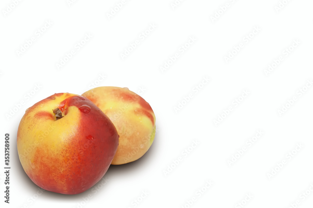 Two juicy and ripe nectarines isolated on a white background. Two juicy and ripe nectarines isolated on a white background.