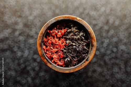 Canvastavla Bowl of the hookah is filled with tobacco mixed with different flavors for Smoking and leisure