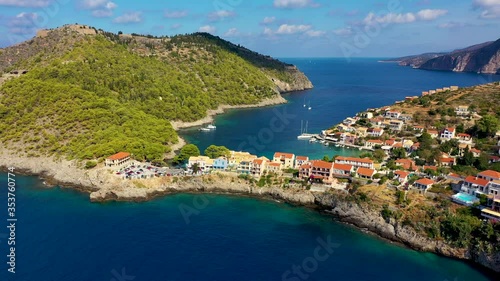 Wallpaper Mural Assos village in Kefalonia, Greece. Turquoise colored bay in Mediterranean sea with beautiful colorful houses in Assos village in Kefalonia, Greece, Ionian island, Cephalonia, Assos village. Torontodigital.ca