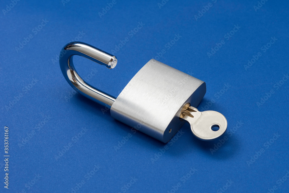 Unlocked Silver Padlock on the blue background. Unlocked Silver Padlock on the blue background.
