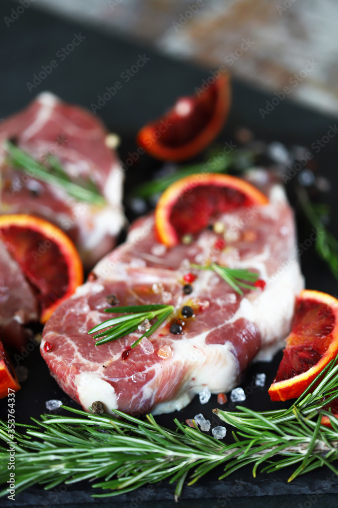 Raw meat steaks with spices. Grilled meat. Raw meat steaks with spices. Grilled meat.