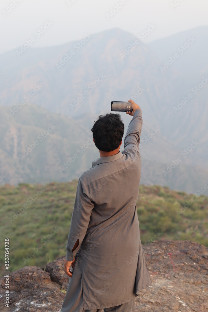 man taking selfie with his cellphone