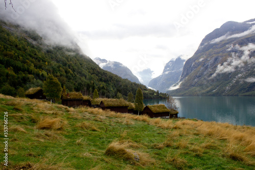 Beautiful norwegian landscape in autumn near Loen and Stryn in Norway.Traditional scandinavian houses with grass roofs.Lovatnet in autumn,photo for printing on calendar,poster,wallpaper,postcard