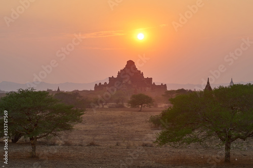 Landscape with an ancient temple at sunset in old Bagan, Myanmar, Burma.