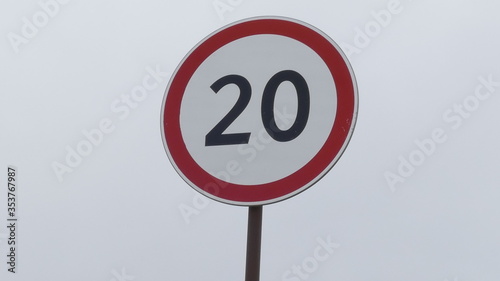there is a speed limit sign on the road