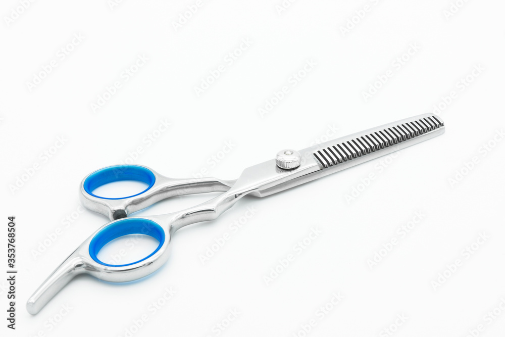 Close-up view of the teeth blade scissor isolated on white background. Close-up view of the teeth blade scissor isolated on white background.