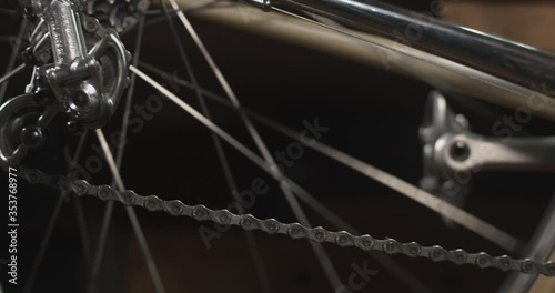 Close up of vintage bike pedaling, chain moving, rear derailleur turning
